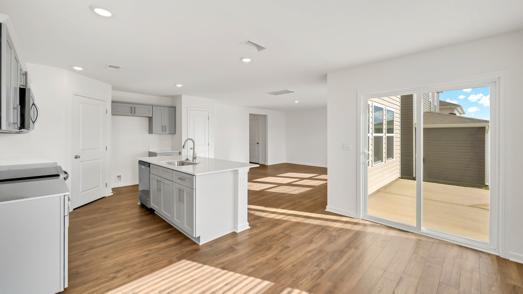 Spacious open concept kitchen with island and counter prep space