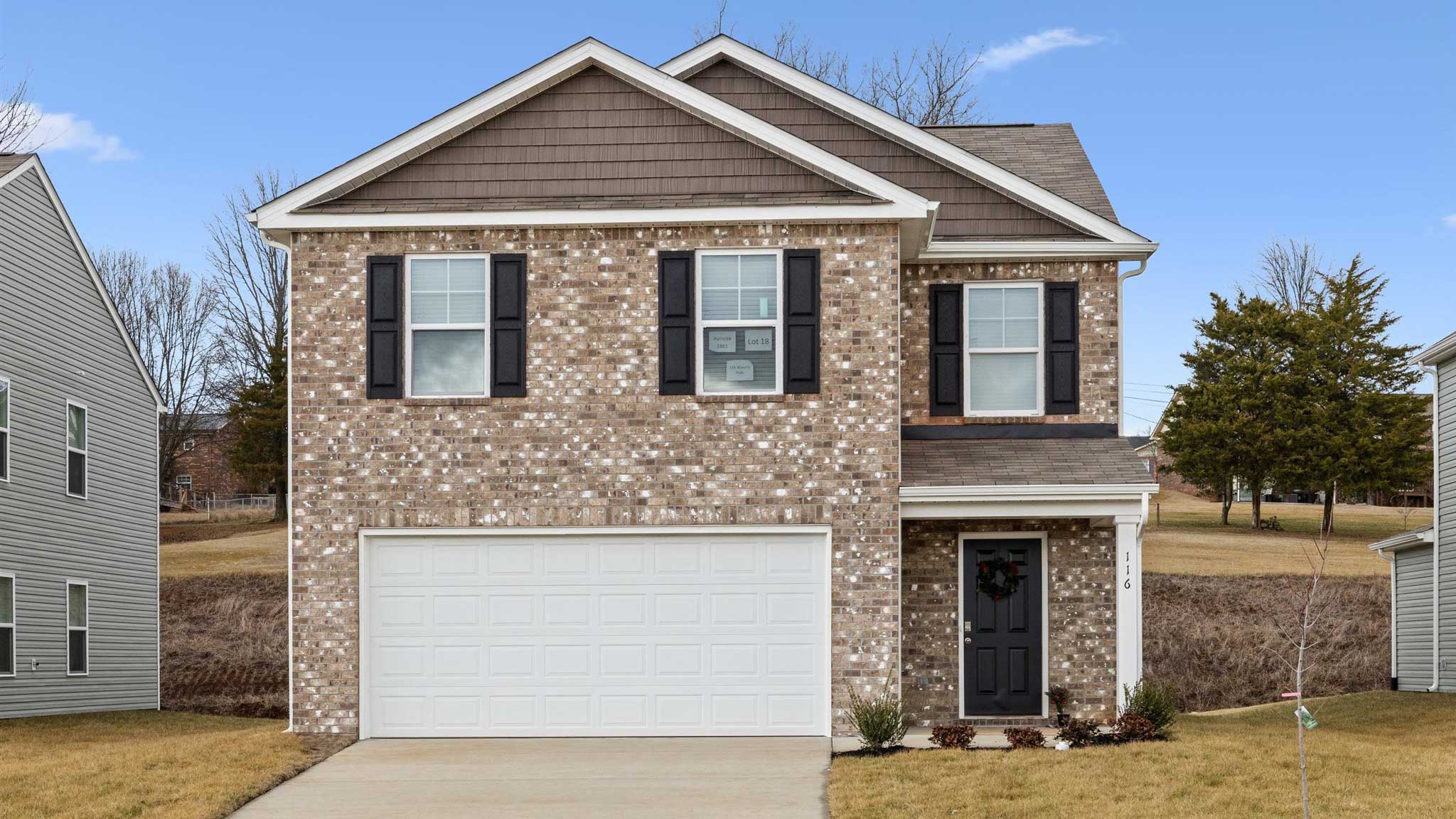 Edmon plan is a two story home with two car garage and side door.