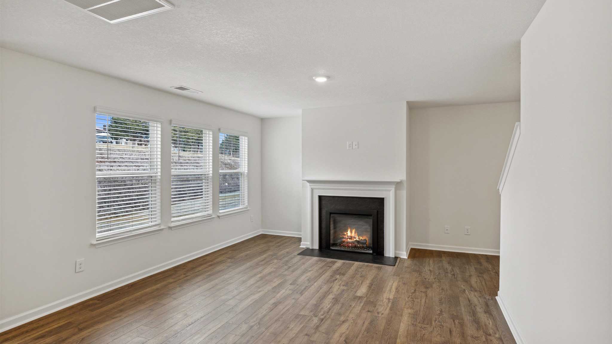 Living area with fireplace and hard flooring.