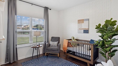 Bedroom staged as a nursery