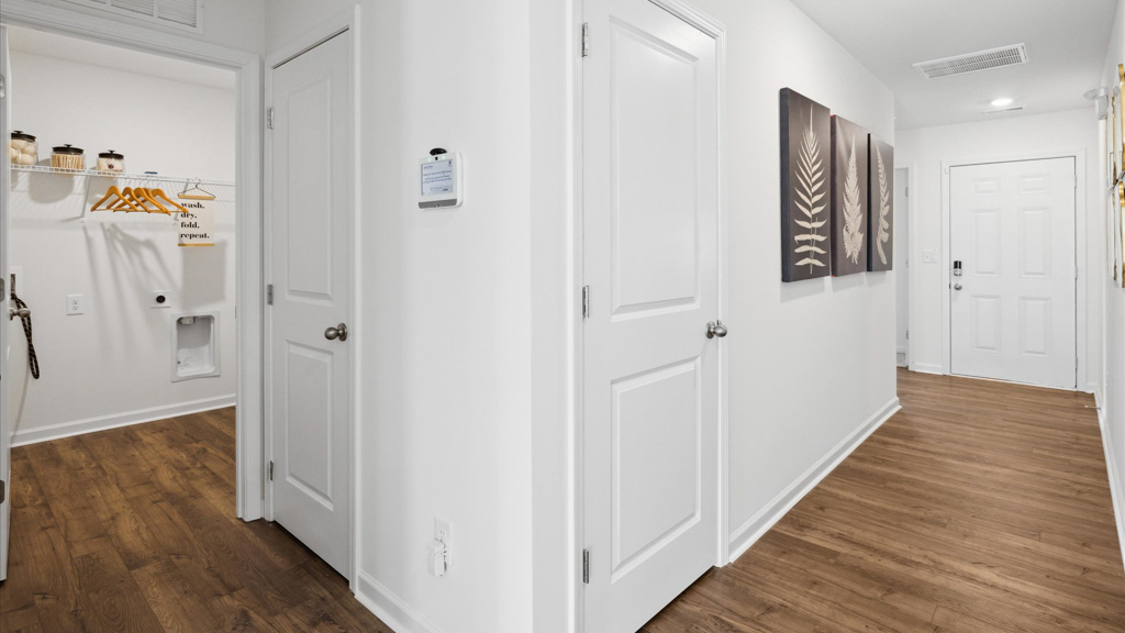 Hallway with art on walls.