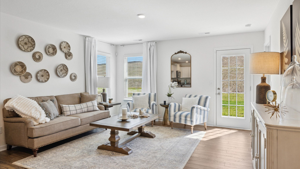 Living room with art on walls and couch.