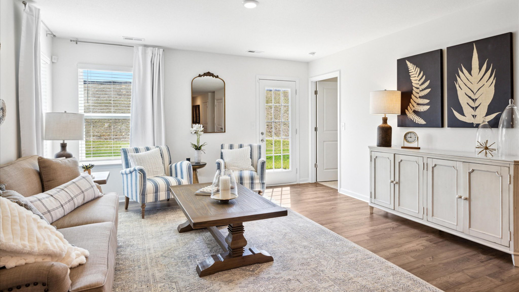 Living room with television on wall and coffee table.