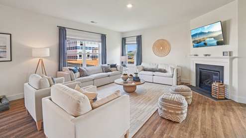 Interior living room with large windows and fireplace