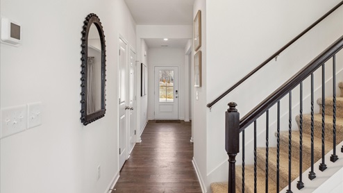 Entrance to home with stairs