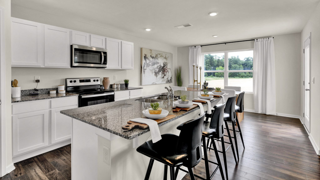 The Darwin floor plan is available at The Hideaway at Fox Meadows in Bluff City, TN. It's a charming two-story home that offers an open-concept main level with a spacious kitchen, pantry, and island with countertop seating. The kitchen overlooks an expansive living area, a well-lit breakfast nook, and an outdoor patio. The foyer has a powder room for convenience. Moving to the upper level, you'll find a desirable primary bedroom with a walk-in closet and private bathroom. There are also two additional bedrooms, each with their own walk-in closet. An additional bathroom and laundry room complete the upstairs of this beautiful home.  D.R. Horton is an Equal Housing Opportunity Builder. Home and community information, including pricing, included features, terms, availability and amenities, are subject to change and prior sale at any time without notice or obligation. Pictures, photographs, colors, features, and sizes are for illustration purposes only and will vary from the homes as built. Images may contain virtual staging.