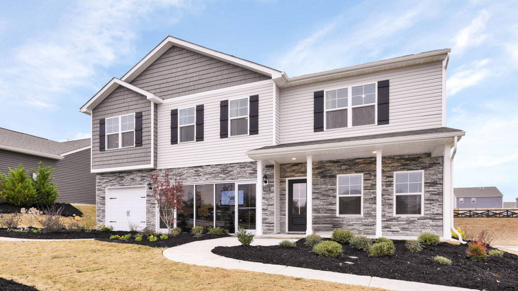 Two story home with brick