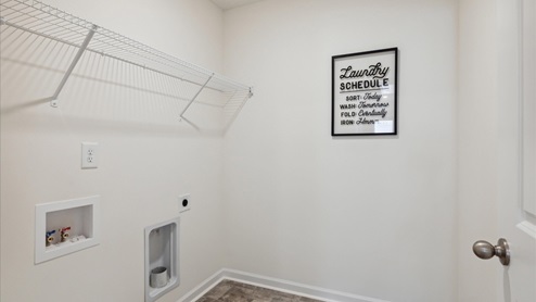 Laundry room with shelving