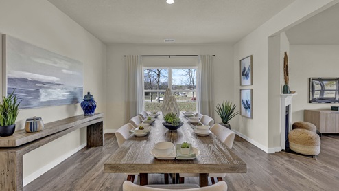 Dining area with double window overlooking yard