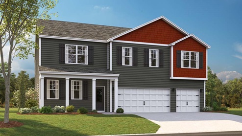 Two story home with vinyl siding and three car garage