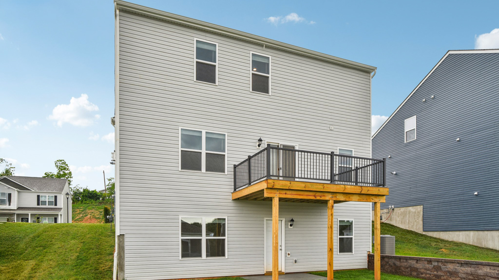 Rear exterior of home with deck.