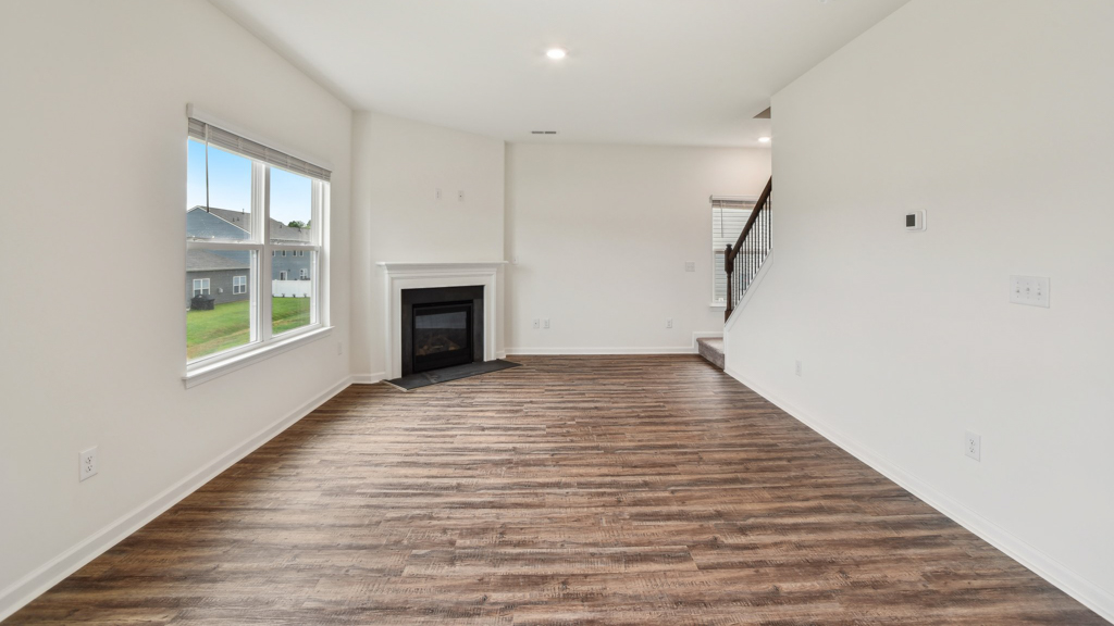 Large living room with direct access to upstairs and downstairs.