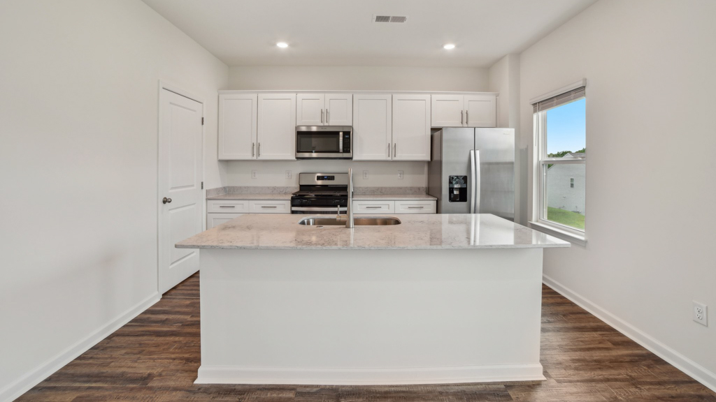 Kitchen with granite countertops.