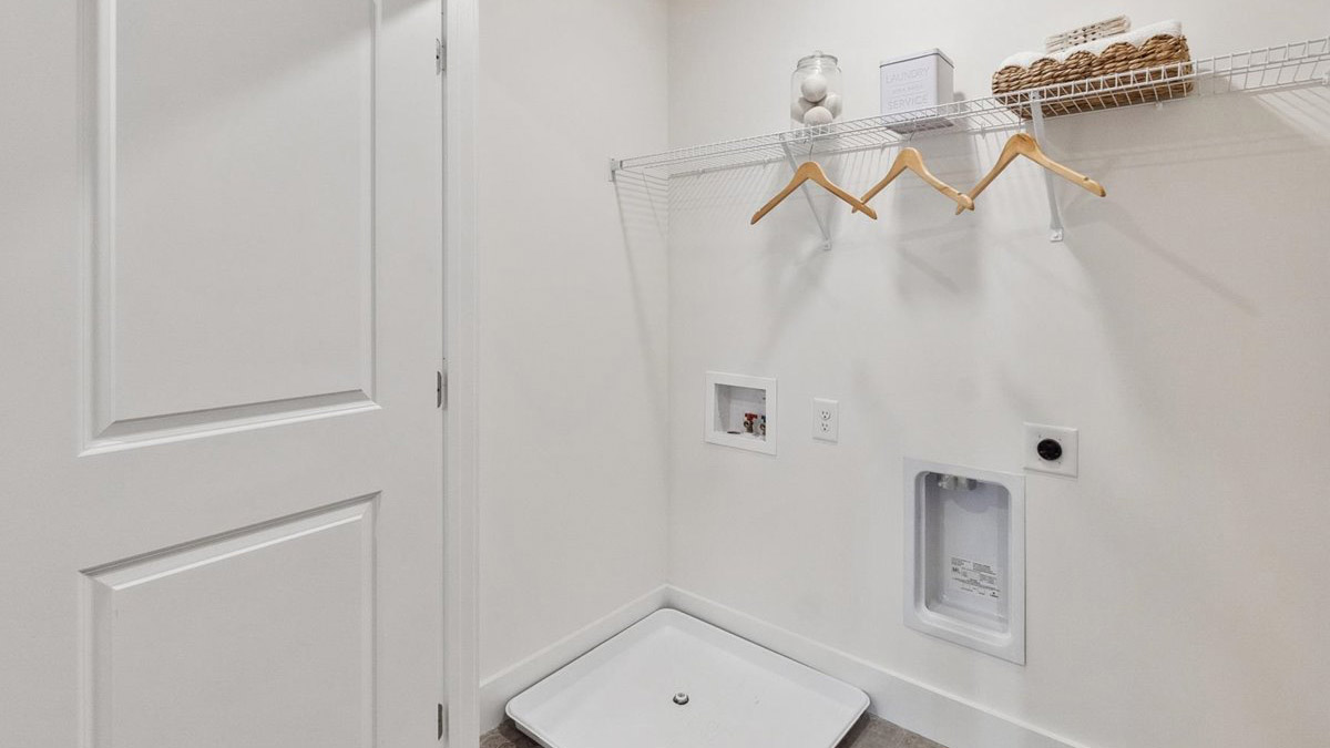 Saint Andrews Garth utility laundry smartly designed with overhead organized storage, a drop zone, with new washer, dryer included