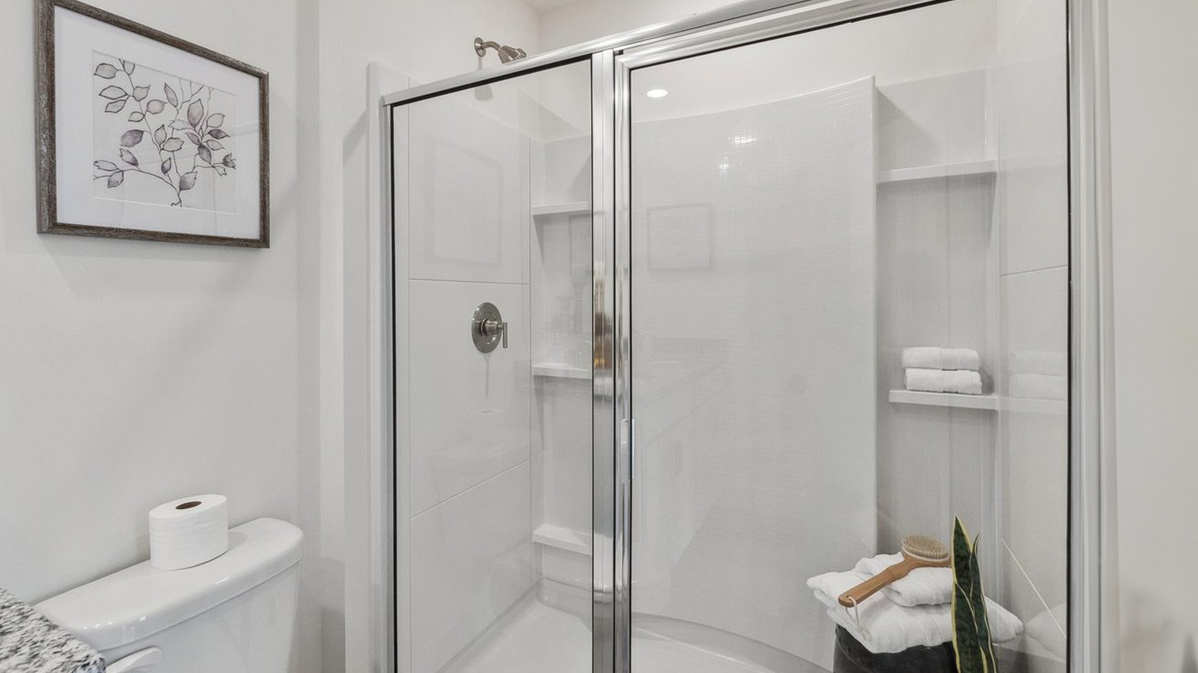 Owner’s ensuite in a D.R. Horton new build home offers function and style with a walk-in closet, spa-like ensuite