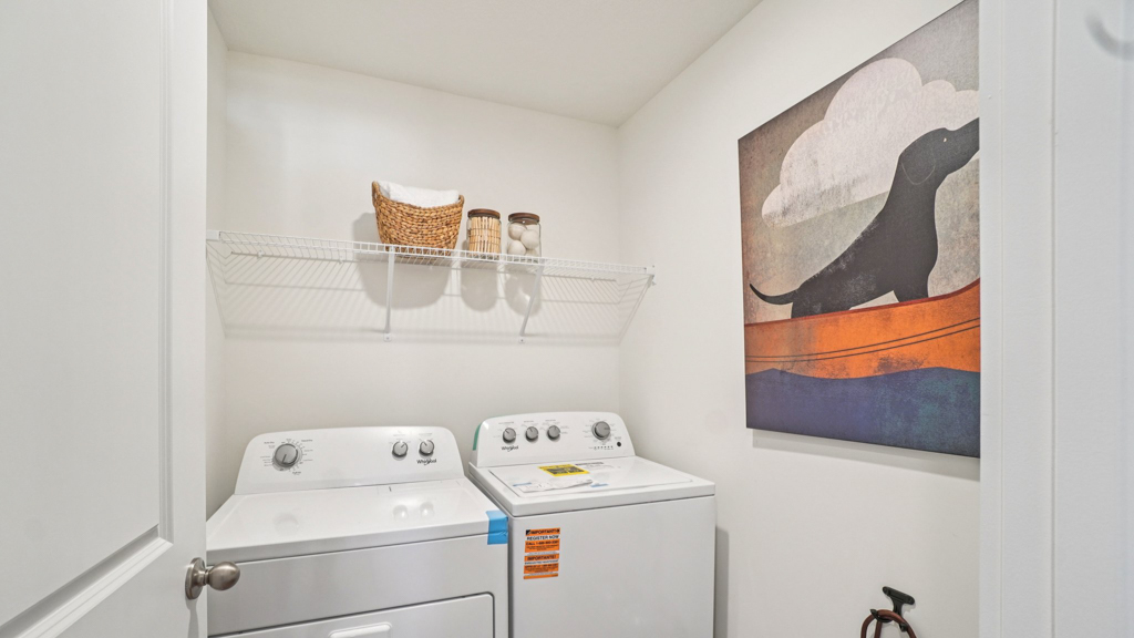 Polo Fields utility laundry smartly designed with overhead organized storage, a drop zone, with new washer, dryer included
