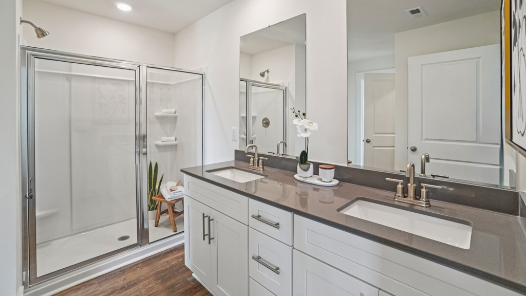 Owner’s ensuite in a new build home offers function and style with a walk-in closet, spa-like ensuite