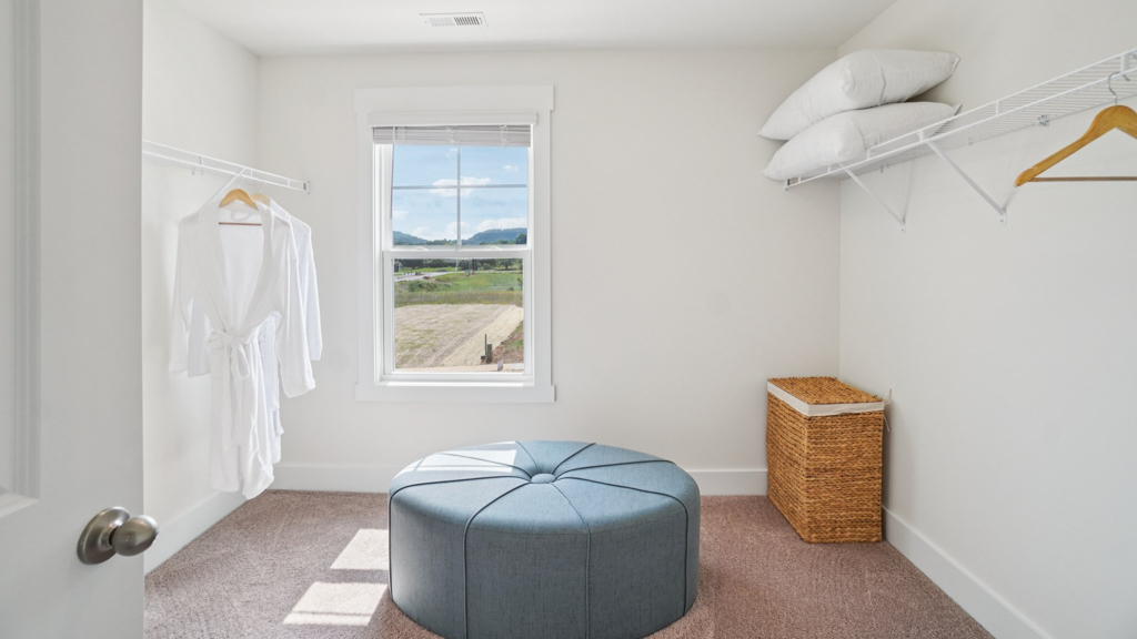 Interior view of walk-in closet in the primary bedroom, spa-inspired ensuite in Polo Fields, a new home by D.R. Horton