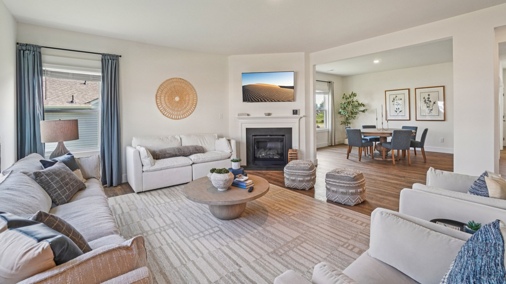 Living room with modern fixtures, electric fireplace, convenient central traffic flow throughout Polo Fields