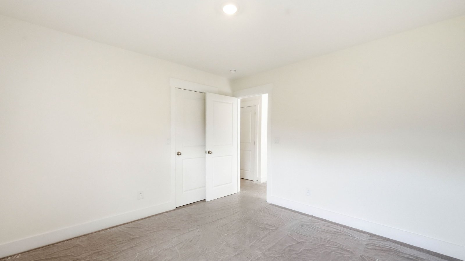 Upstairs bedroom with carpet and window