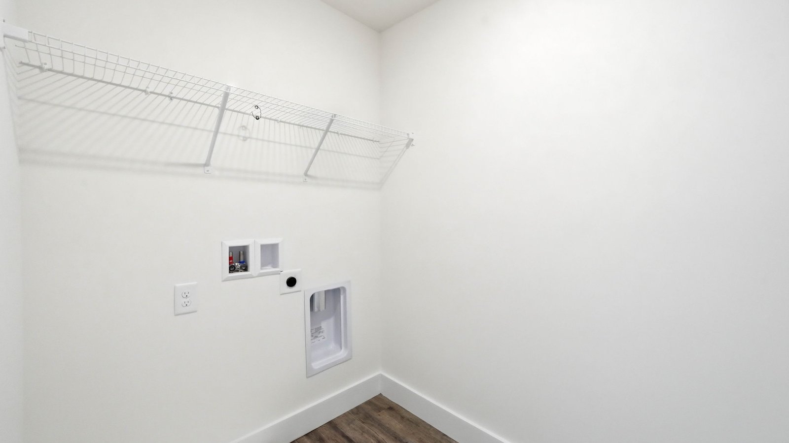 Laundry room with shelving