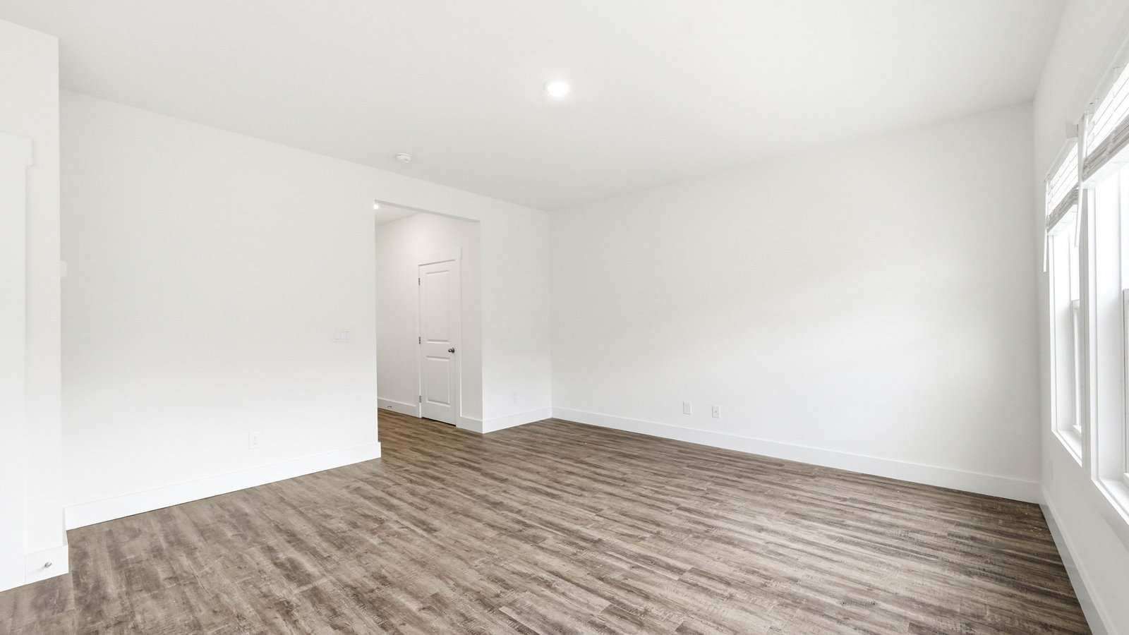 Bedroom with hard flooring and window