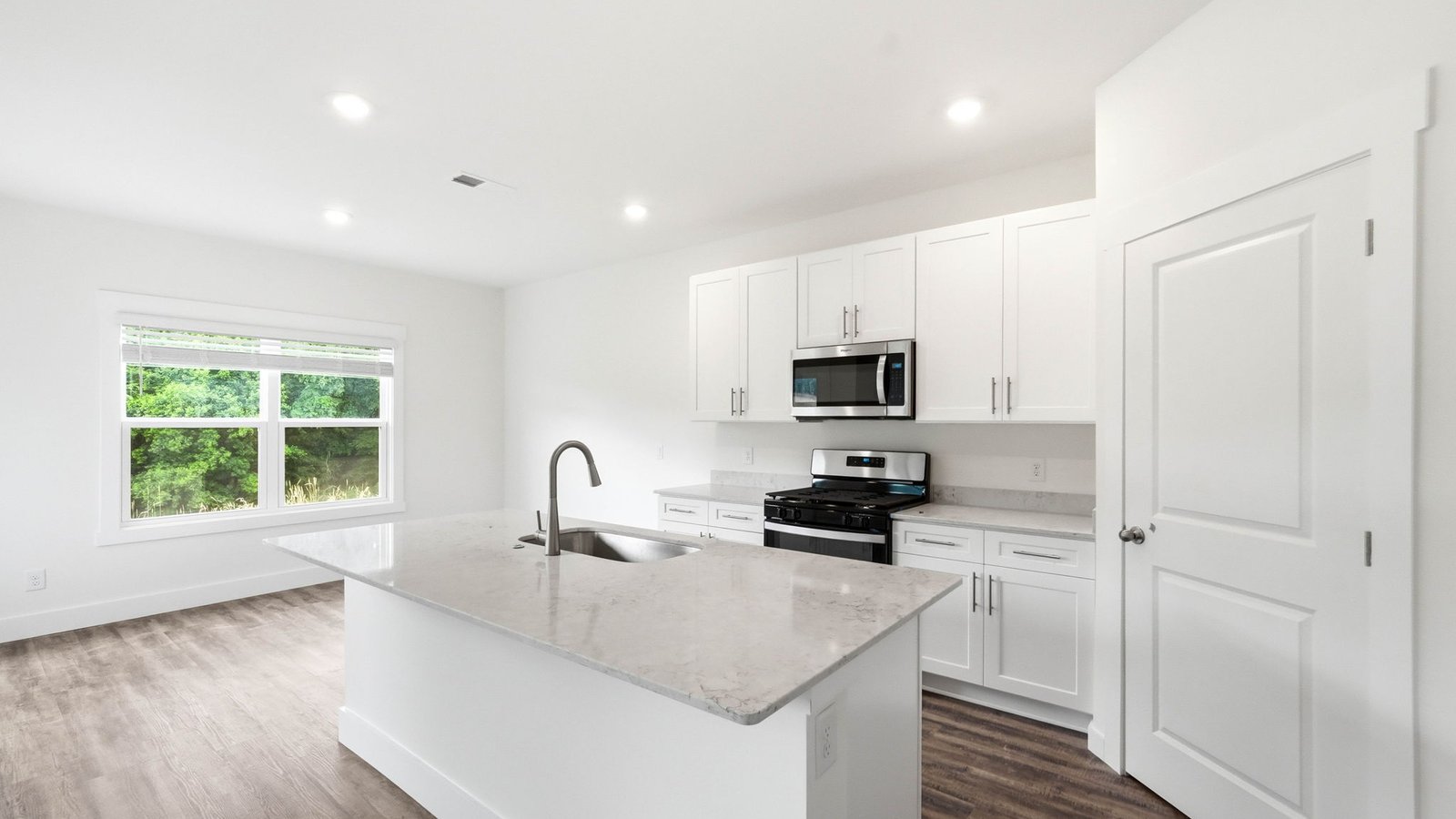 Kitchen with island and recessed lighting
