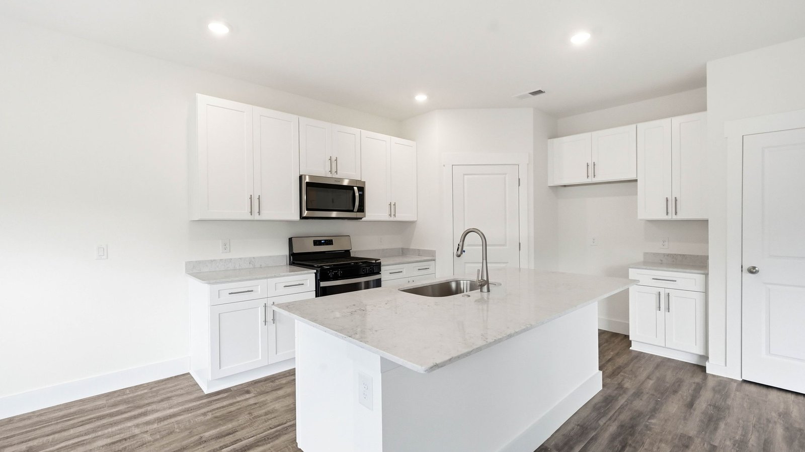 Kitchen with appliances and island