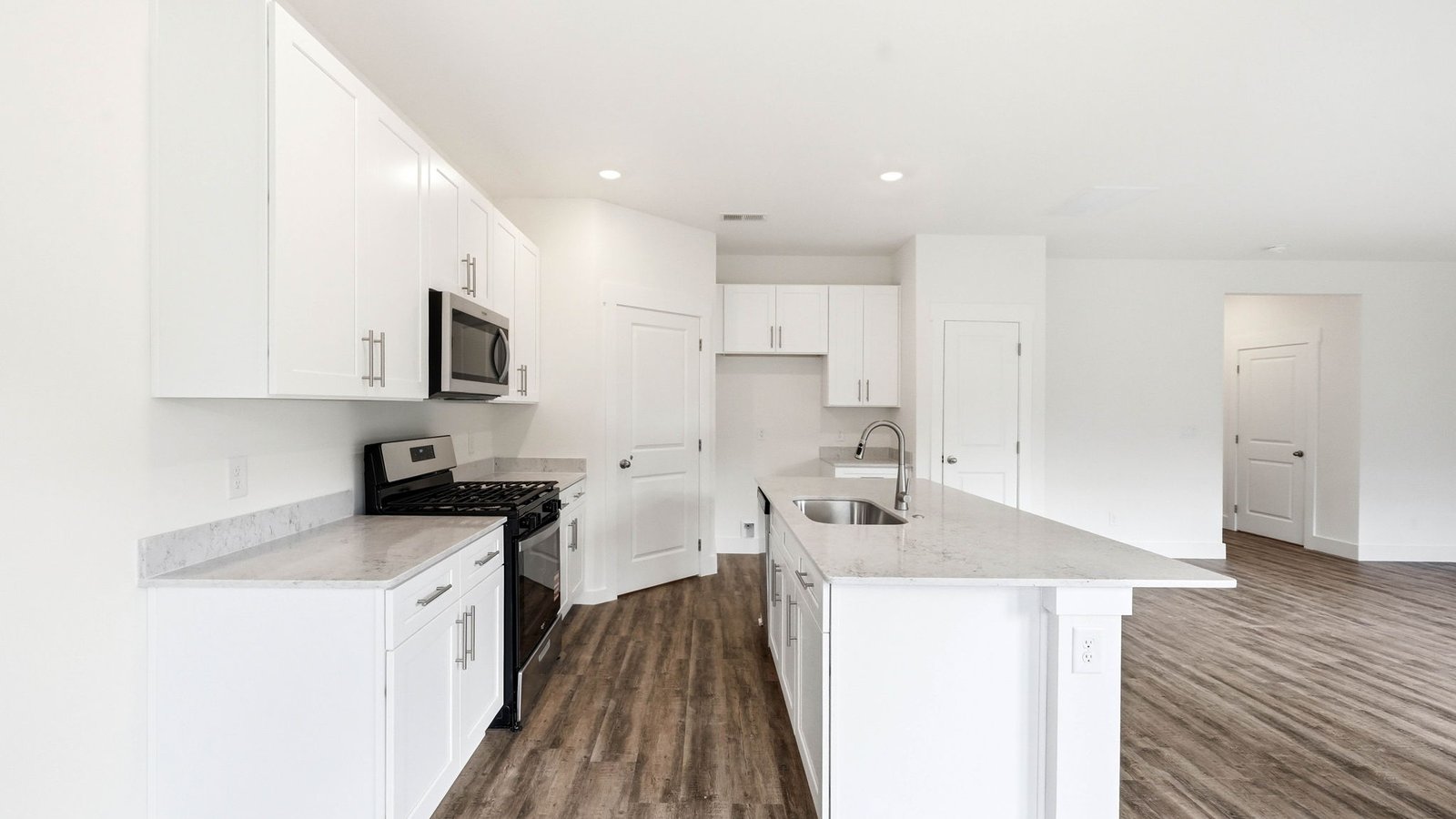 Open kitchen with island and appliances