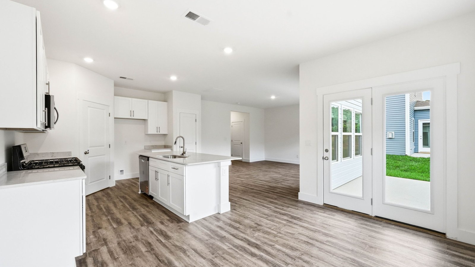 Open kitchen with island and appliances