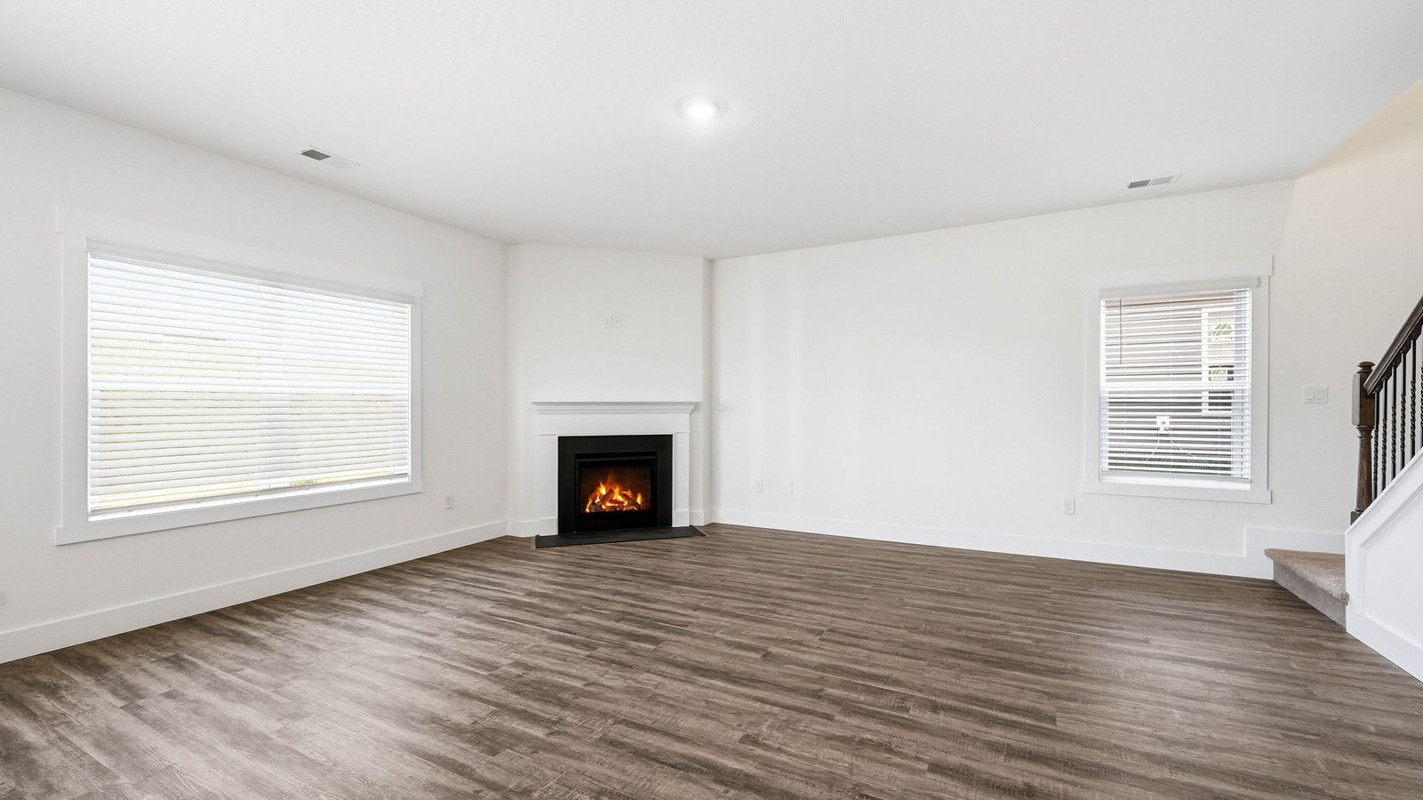 Living area with windows and fireplace