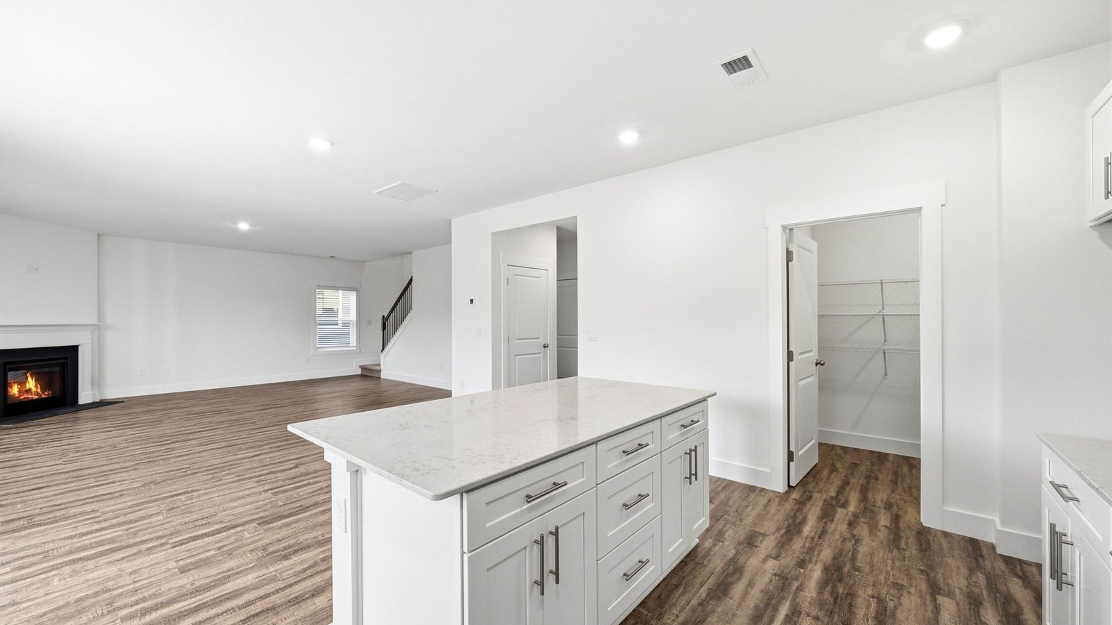Kitchen with pantry opens into living area