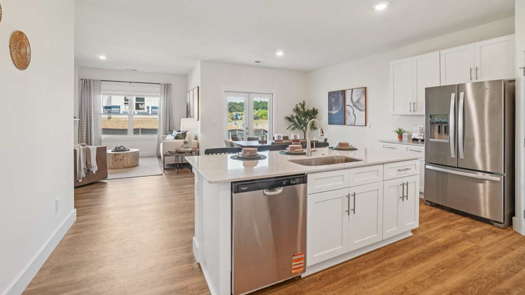 View from kitchen to the living room, backyard area, adding our fresh open design at Saint Andrews Garth