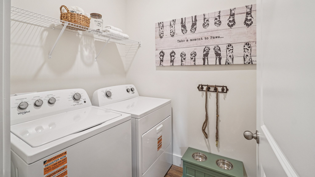 Saint Andrews Garth utility laundry smartly designed with overhead organized storage, a drop zone, with new washer, dryer included