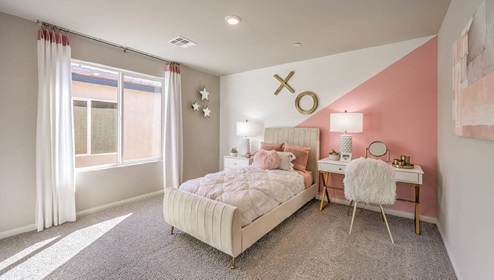Bedroom Three in our Spectrum Falls 2988 model with carpet flooring and a large window.