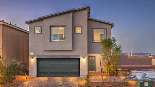 Exteriors in the Spectrum Falls community featuring designer selected paint schemes, front yard landscaping, paver walkways, and two-car garages.