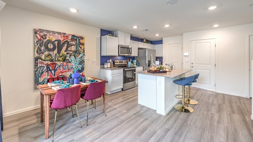 Our 1410 model kitchen in the Spectrum Trails Community with white shaker style cabinets, quartz countertops, and Whirlpool Stainless Steel appliances.