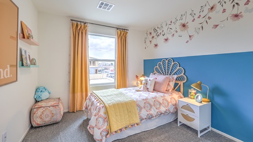 Bedroom Three in our Spectrum Trails 1309 model with carpet flooring, a sliding closet and one window.