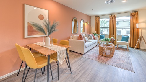 The Spectrum Trails 1309 model Dining Space adjacent to the kitchen with a table and window.