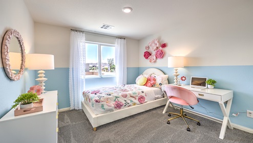 Bedroom Four in our Cambria Bay 1865 model with carpet flooring, a sliding closet, and one window.