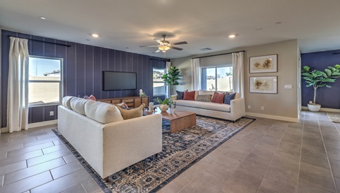 The Symmetry Manor 2754 Plan open concept Great Room with ceramic tile flooring and large windows.