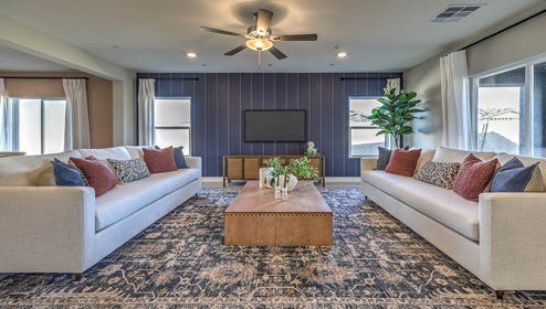 The Symmetry Manor 2754 Plan open concept Great Room with ceramic tile flooring and large windows.