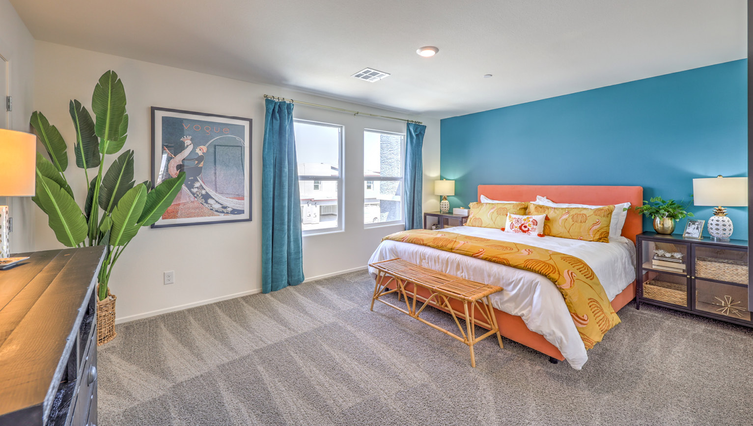 The Tempo Trails 1309 Plan open concept Great Room with LVP panel flooring and a view of the kitchen.