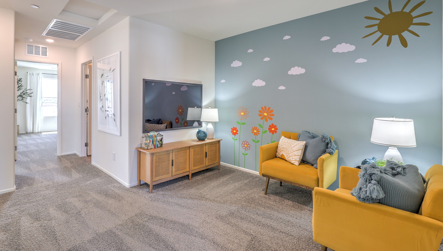 The upstairs loft in our Tempo Trails 1410 model with carpet flooring and a closet.