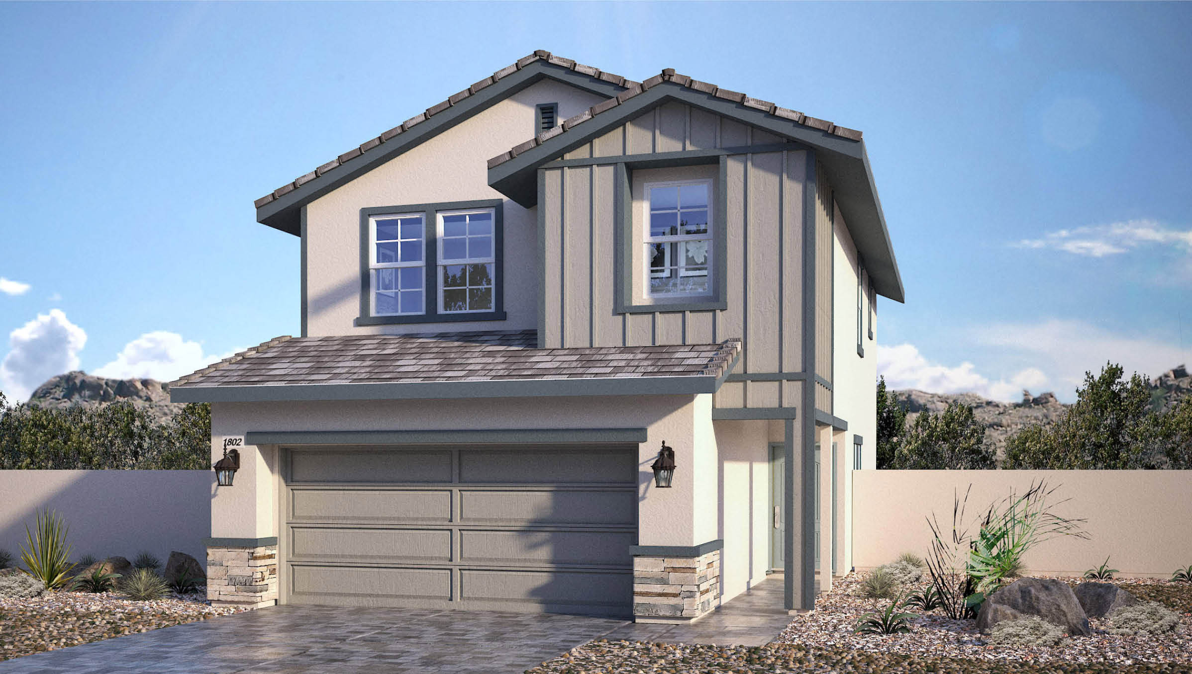 Our 1802 Plan home features a modern farmhouse design with a white stucco and gray board-and-batten exterior. It includes a gray two-car garage, stone veneer accents, and a coordinating gray flat tile roof. The front yard is designed with drought-resistant landscaping, featuring decorative rocks and native plants for a stylish, low-maintenance appeal.