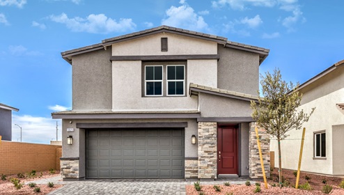 Our 2436 model home in the Symmetry Falls community with tan and light brown exterior paint, a flat tile roof, 2-car garage, front yard landscaping, and paver driveway and walkways.