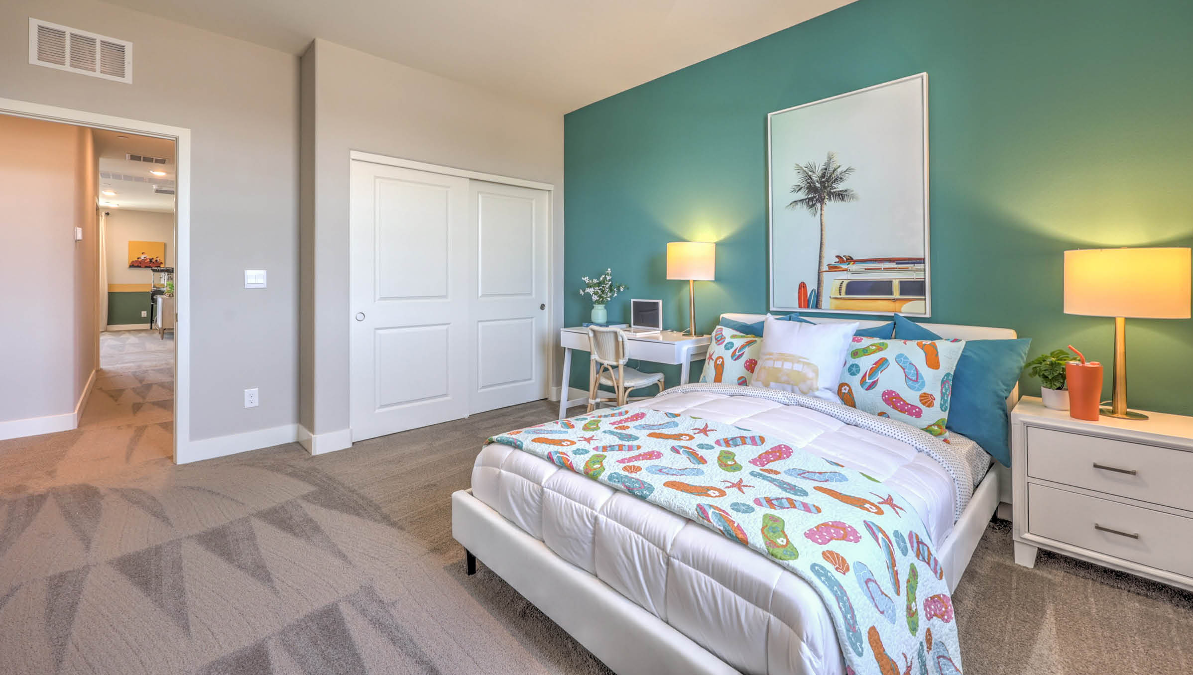 Bedroom Four in our Symmetry Summit 3765 model with carpet flooring, a walk-in closet, and a window.