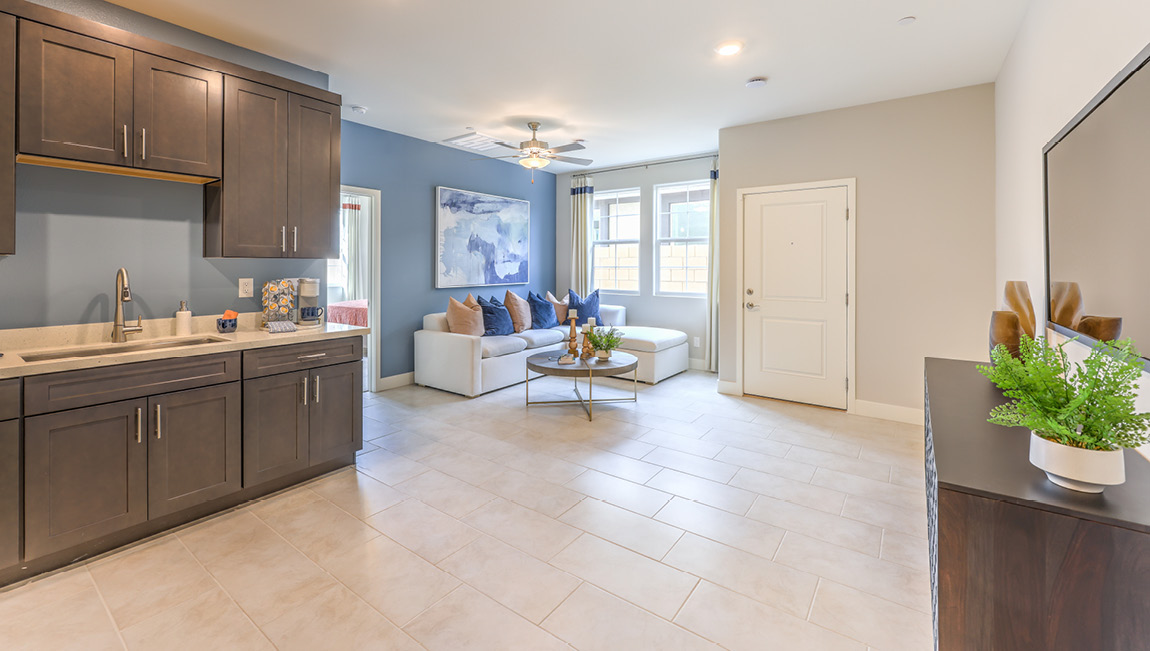 Our Symmetry Summit 4425 Multigen Suite with a kitchenette and living area.