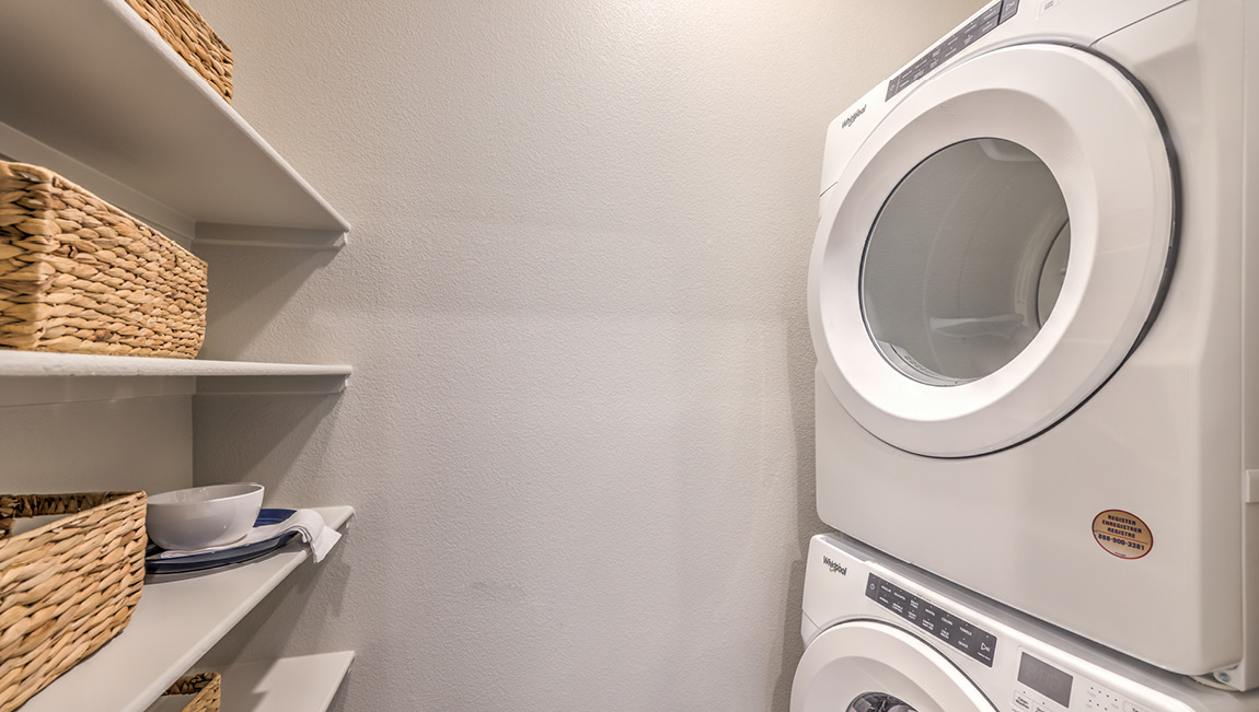The laundry room in our 4425 model Multigen Suite with a washer and dryer.