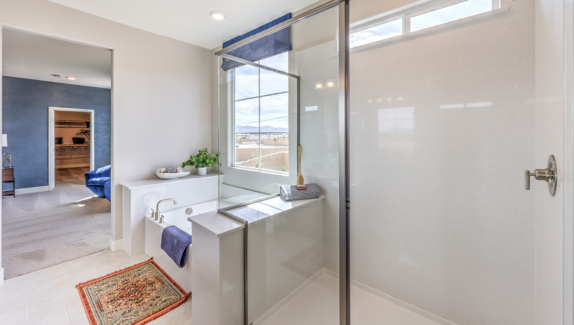 Our 4425 model bathroom attached to the Bedroom One Suite with a walk-in shower and bathtub.